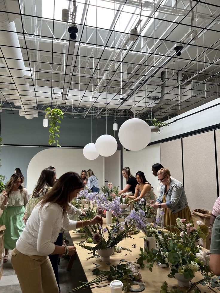 group of people at a team building floral art workshop