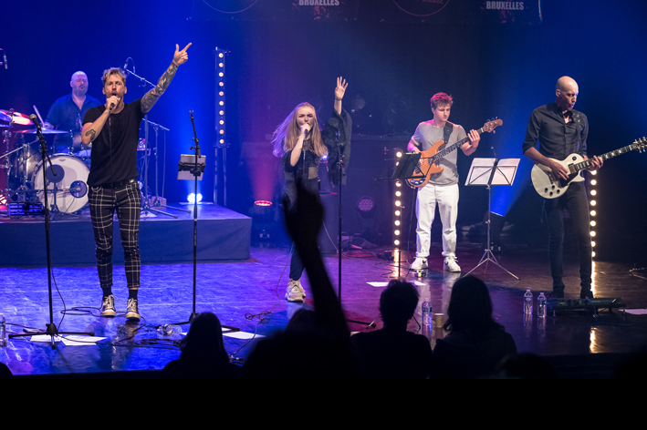 people on stage at a Rock school music workshop