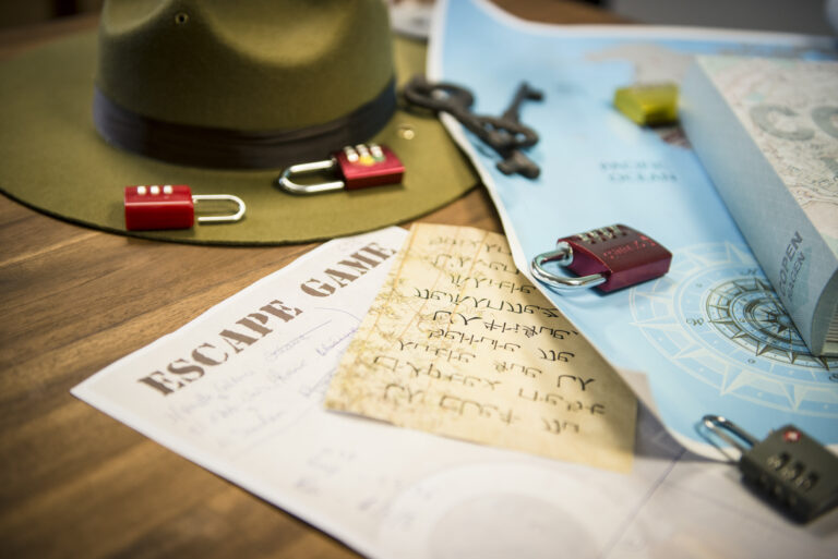 padlocks and riddles on a table during an escape game