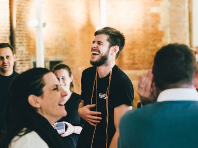 happiness and laughter during a team building session with collaborative challenges