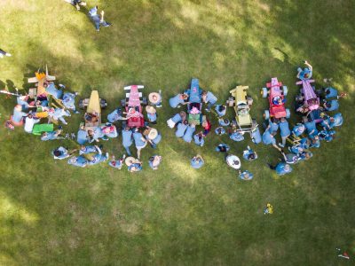 drone view of a team building activity with all the teams and their cardboard cars on the starting line