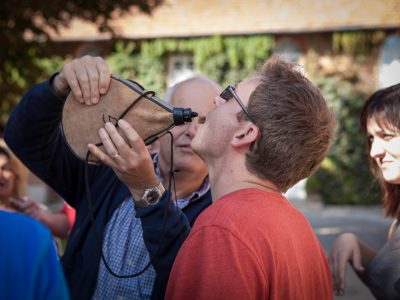 participant drinking from a flask during a challenge