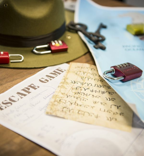 padlocks and riddles on a table during an escape game