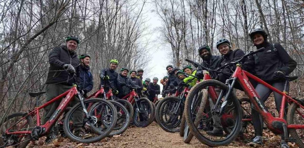 team up for an electric mountain bike ride in the forest